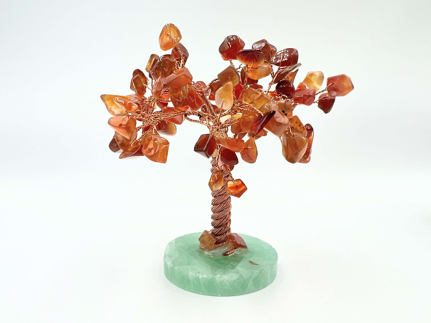 Carnelian crystal gem tree on white surface