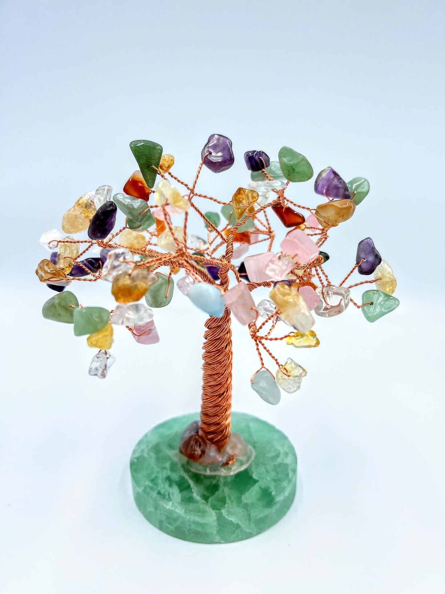 Mixed crystals crystal gem tree on white surface