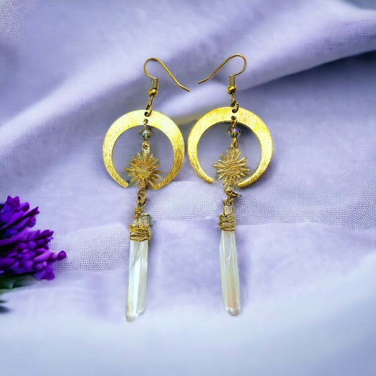 Gold Half Moon Earrings With Clear Quartz on purple fabric 