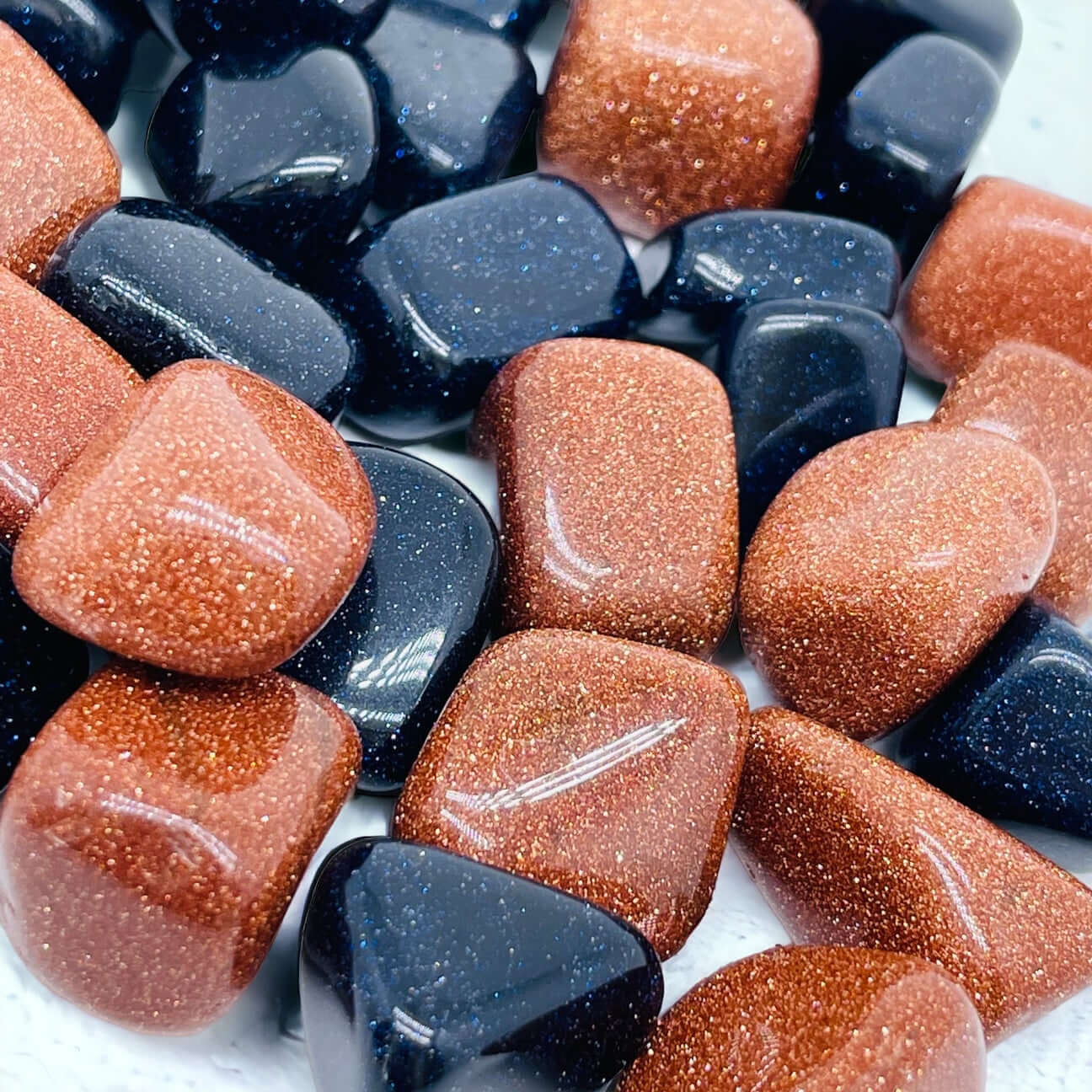 Goldstone and blue gold stone tumbled stones. 