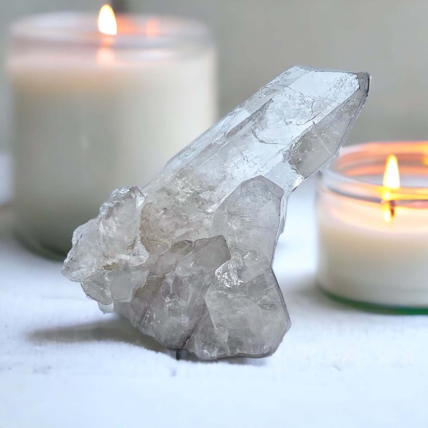 Clear Quartz point on white surface