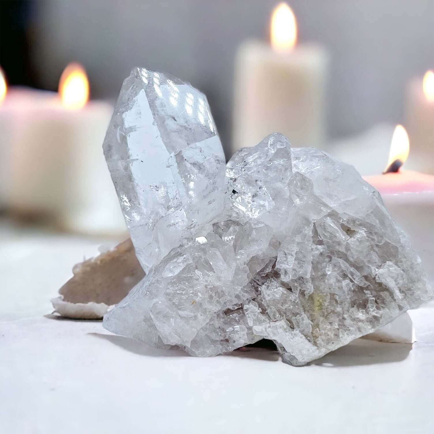 Clear Quartz cluster on white surface