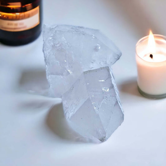 Clear Quartz point on white surface