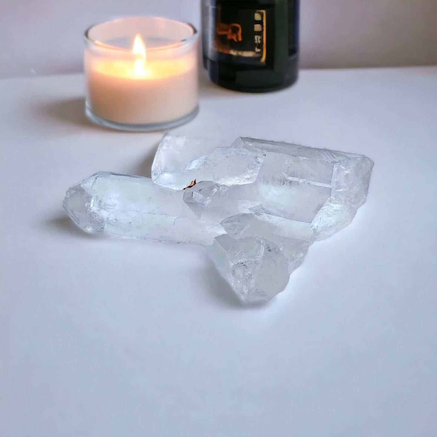 Clear Quartz cluster on white surface