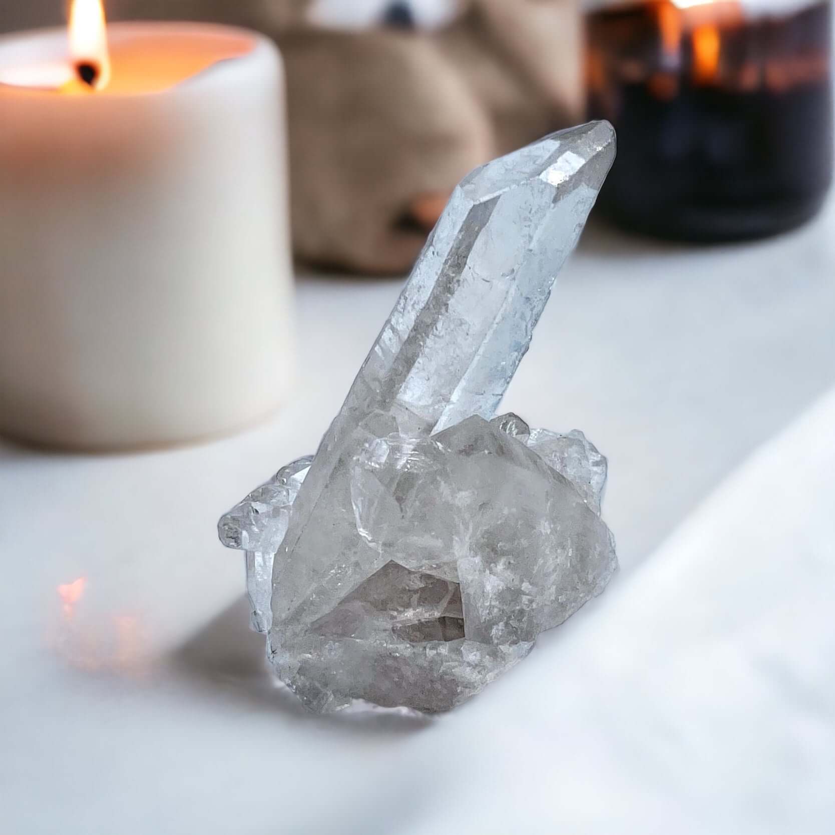 Clear Quartz cluster on white surface