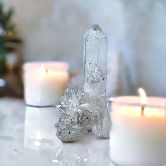 Clear Quartz cluster on white surface