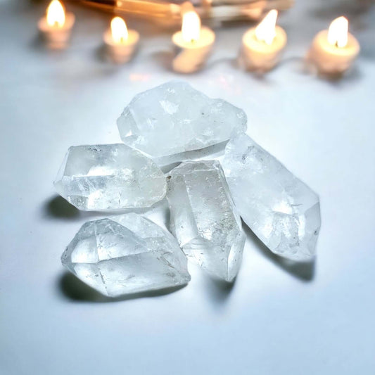 Clear Quartz point on white surface