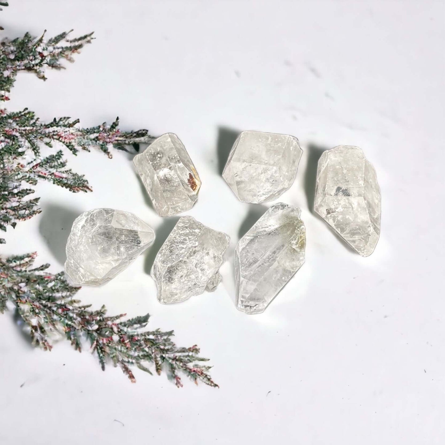 Clear Quartz points on white surface