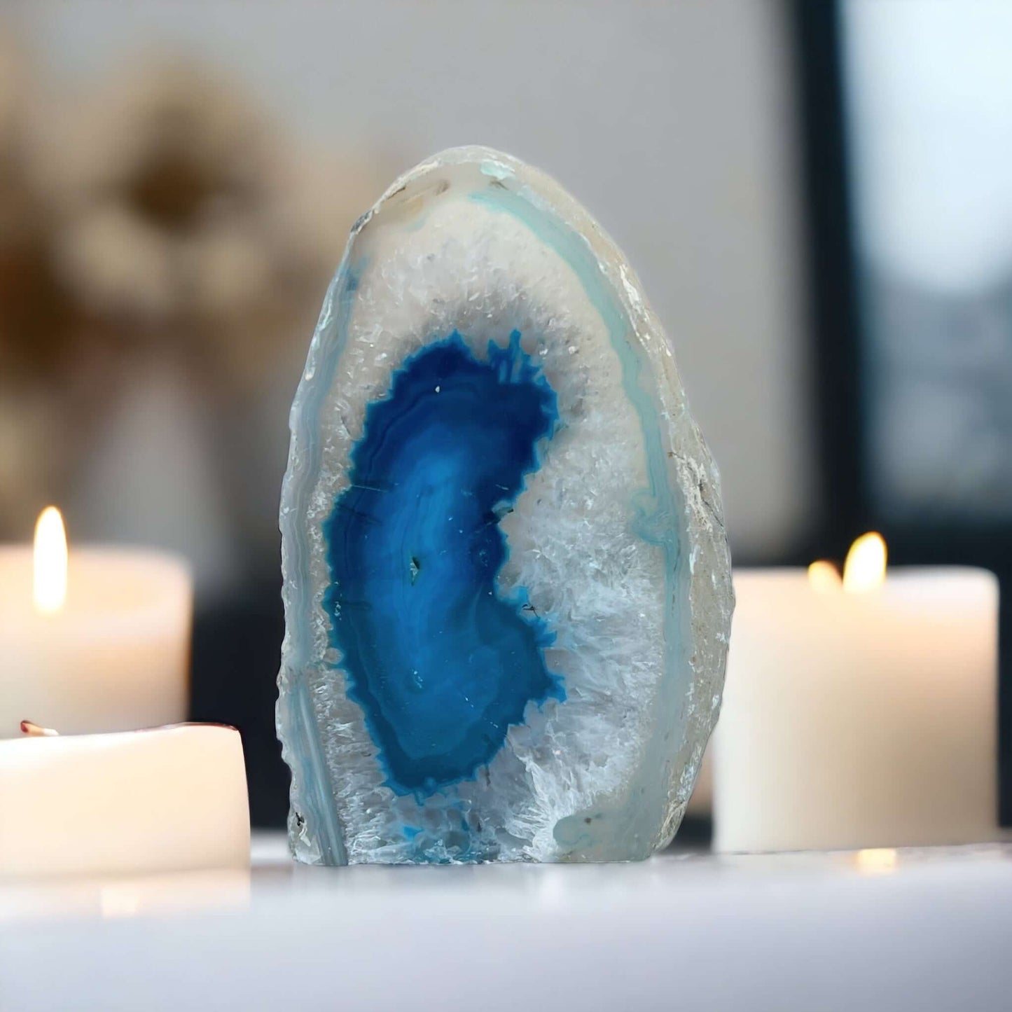 Blue agate candle holder with candles in the background