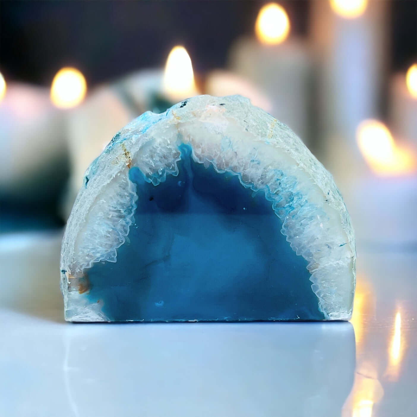 Blue agate candle holder with candles in the background