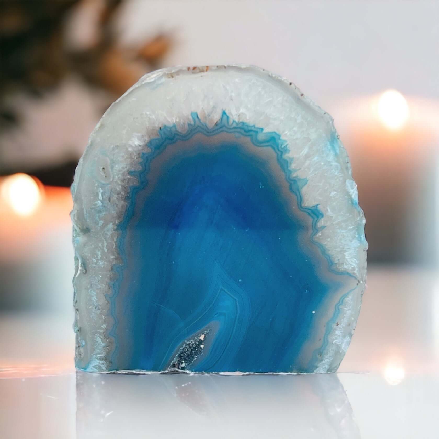 Blue agate candle holder with candles in the background