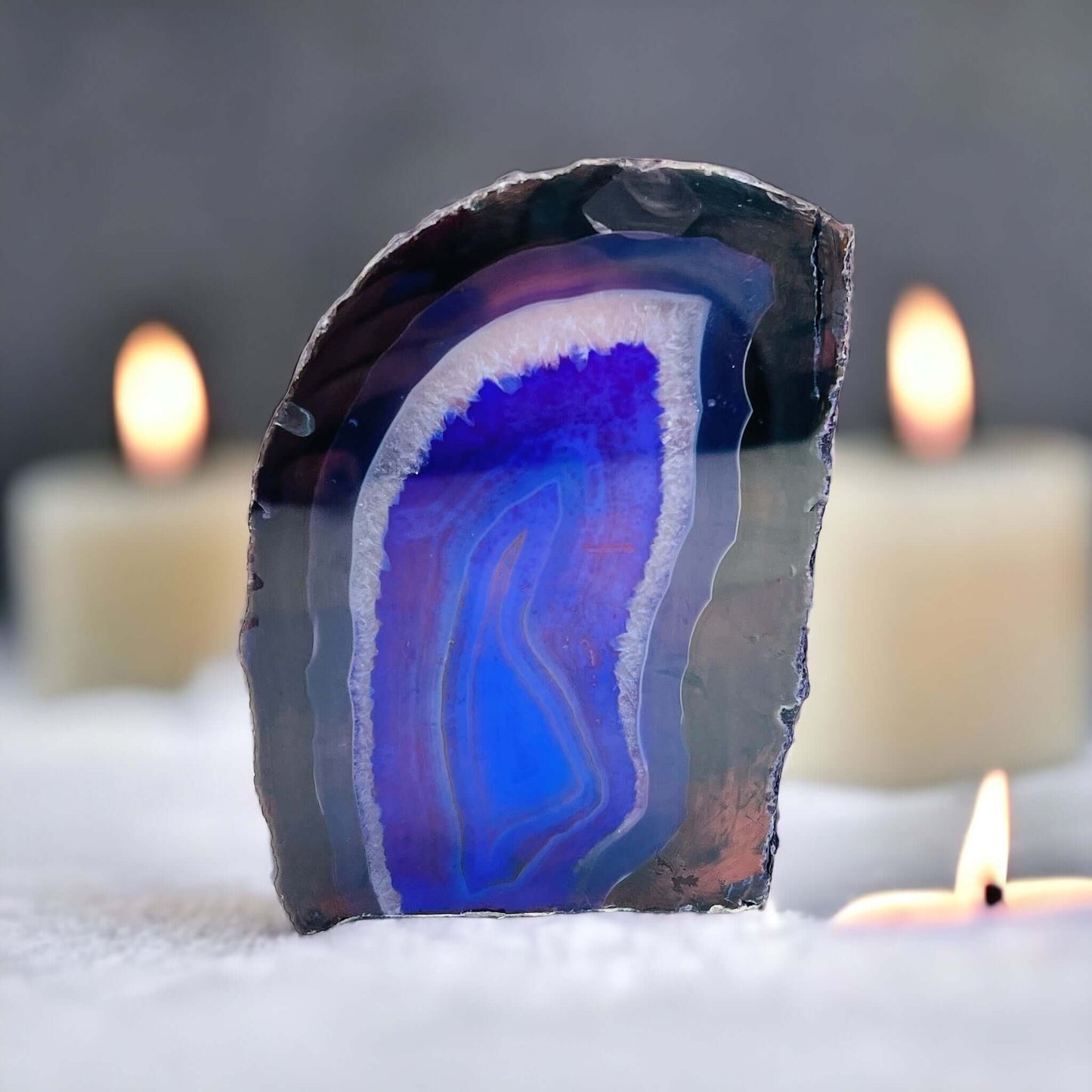 Purple agate candle holder with candles in the background