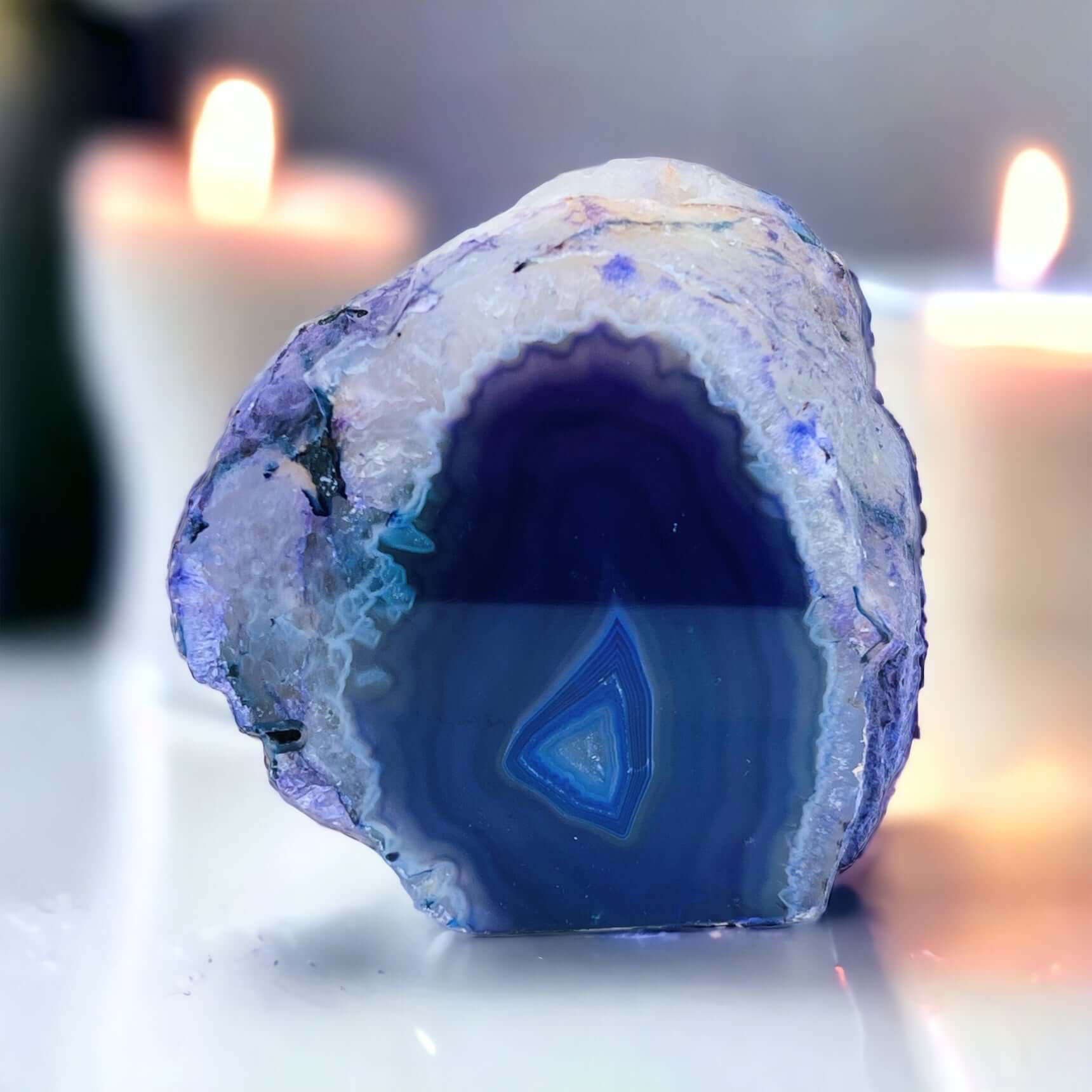 Purple agate candle holder with candles in the background