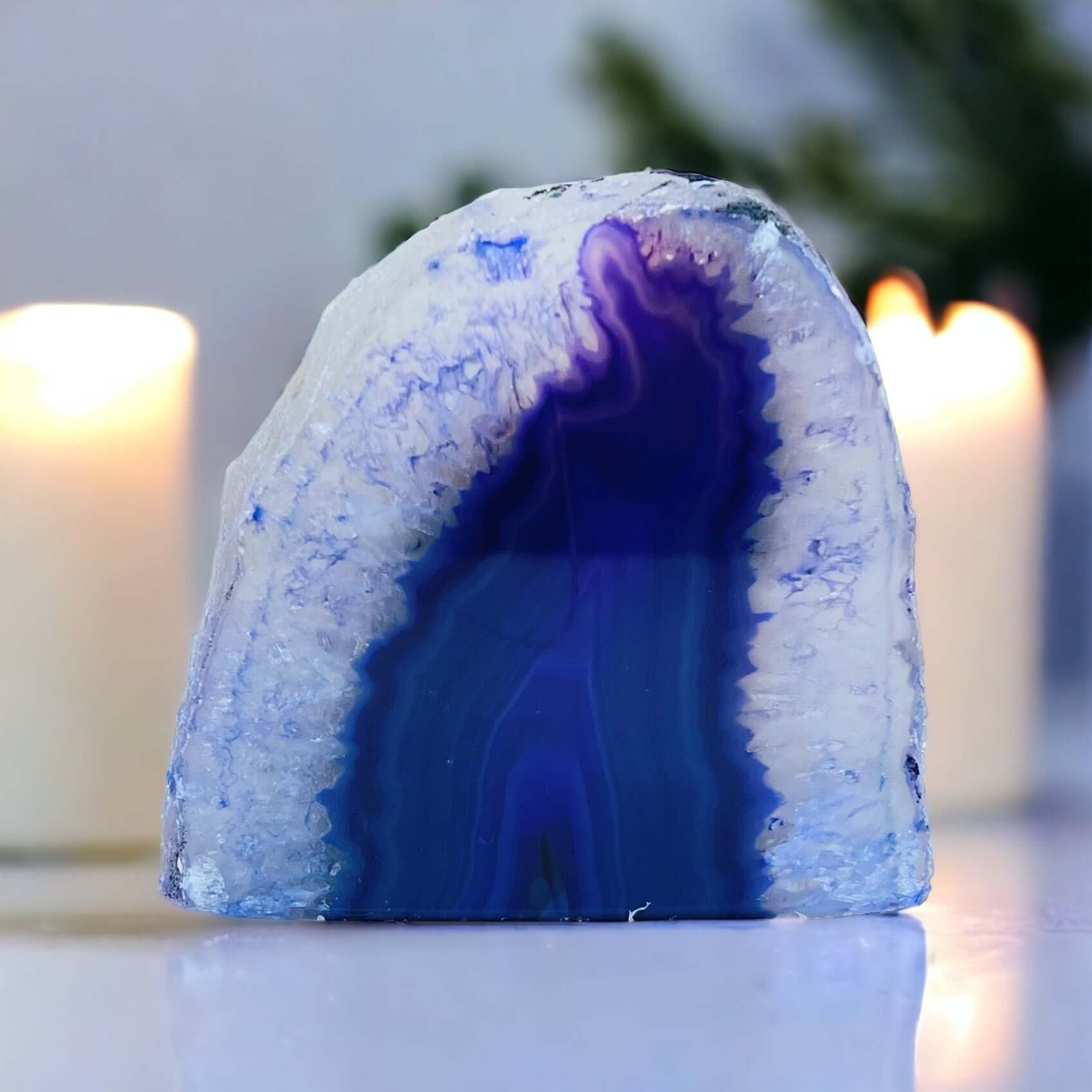 Purple agate candle holder with candles in the background