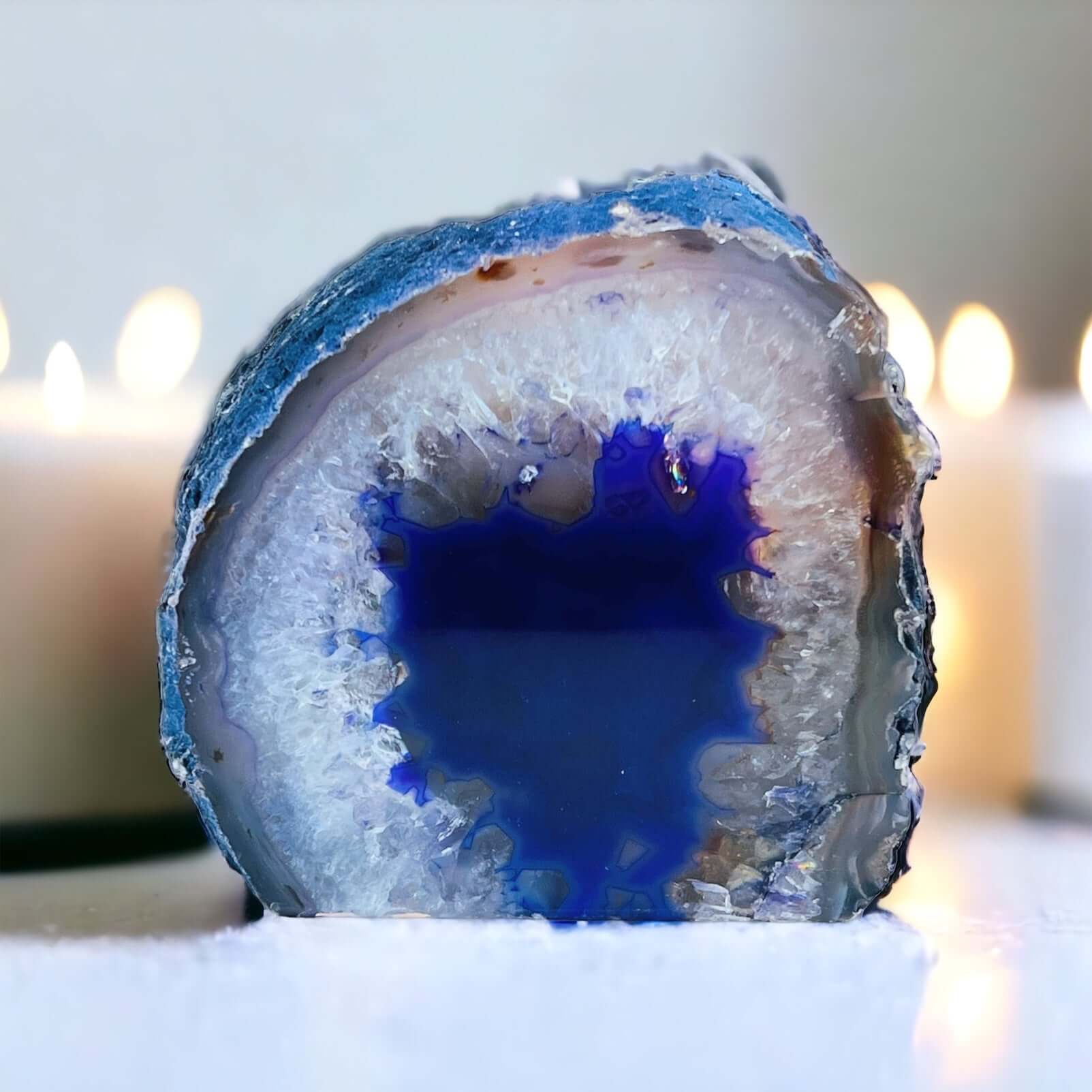 Purple agate candle holder with candles in the background