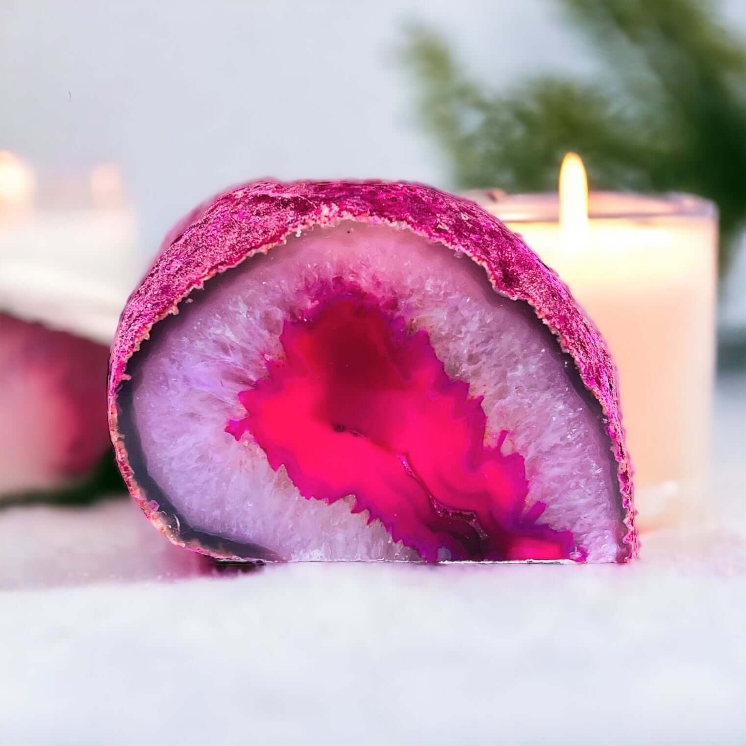 Pink agate candle holder with candles in the background