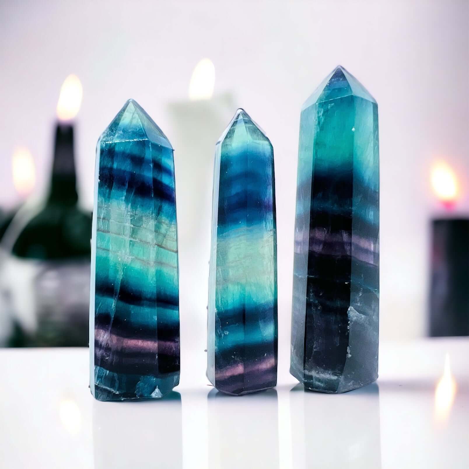 Several fluorite towers on white surface. 