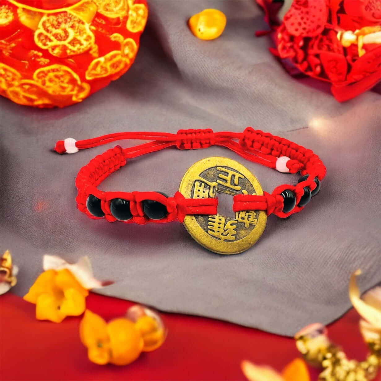 Eng shui lucky coin bracelet on great surface with Chinese decorations. 