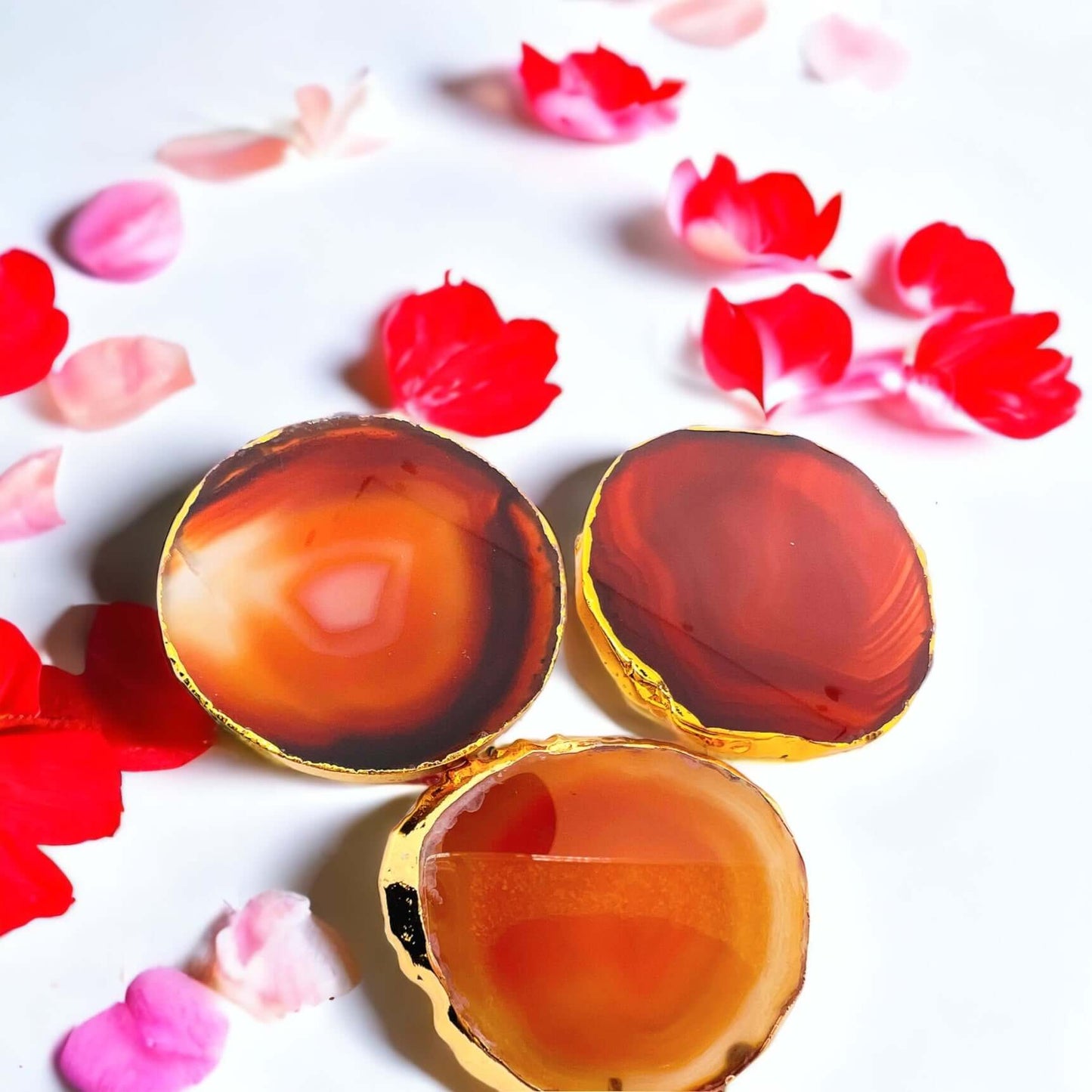 Orange agate pop sockets with gold edge.