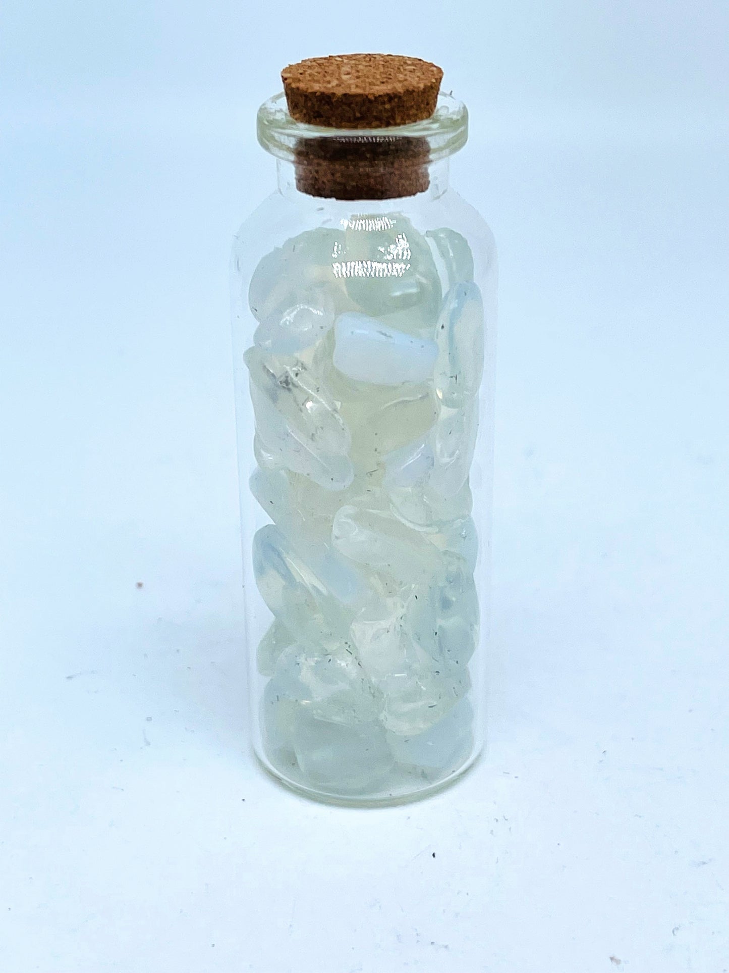 Opalite crystal chip bottle on white background