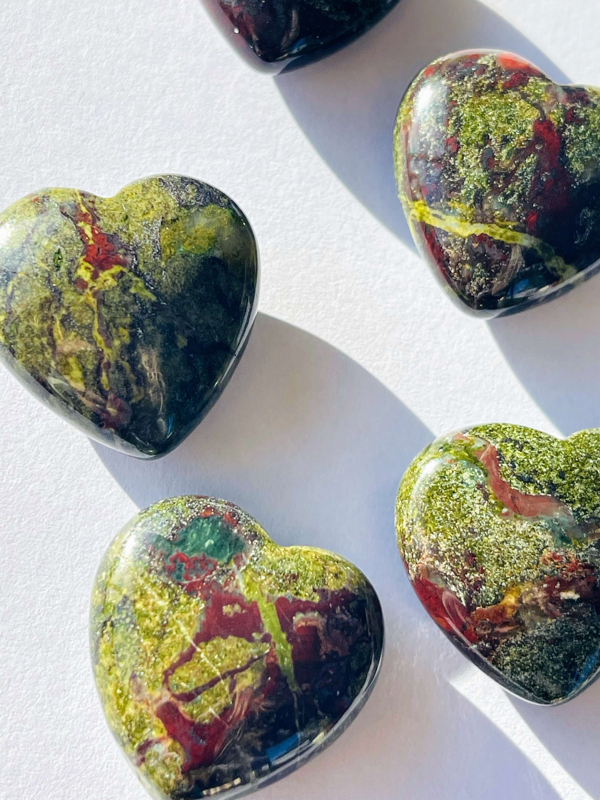 Dragons blood jasper Crystal Hearts on white background 