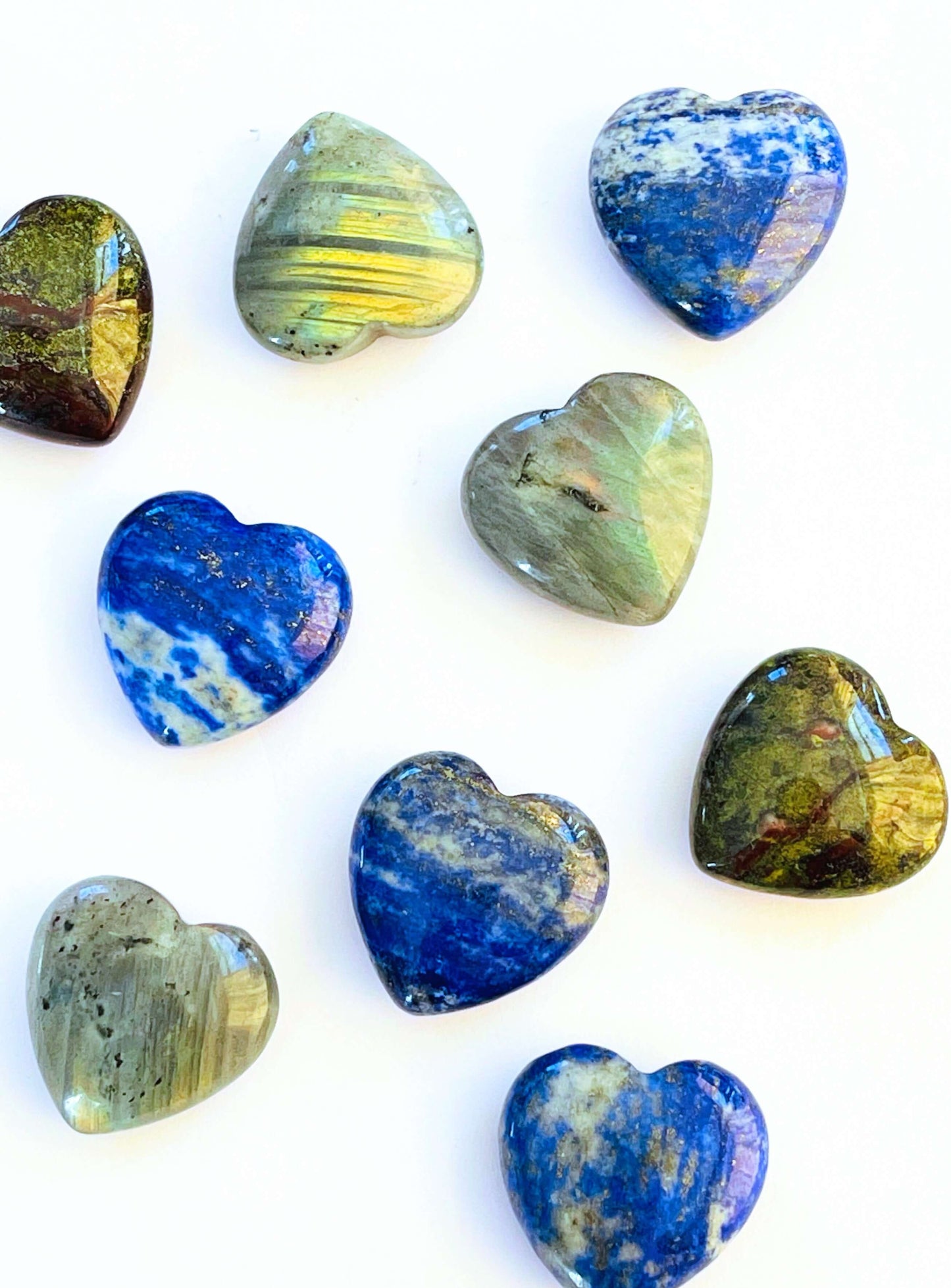 Small carved Crystal Hearts of different stones 