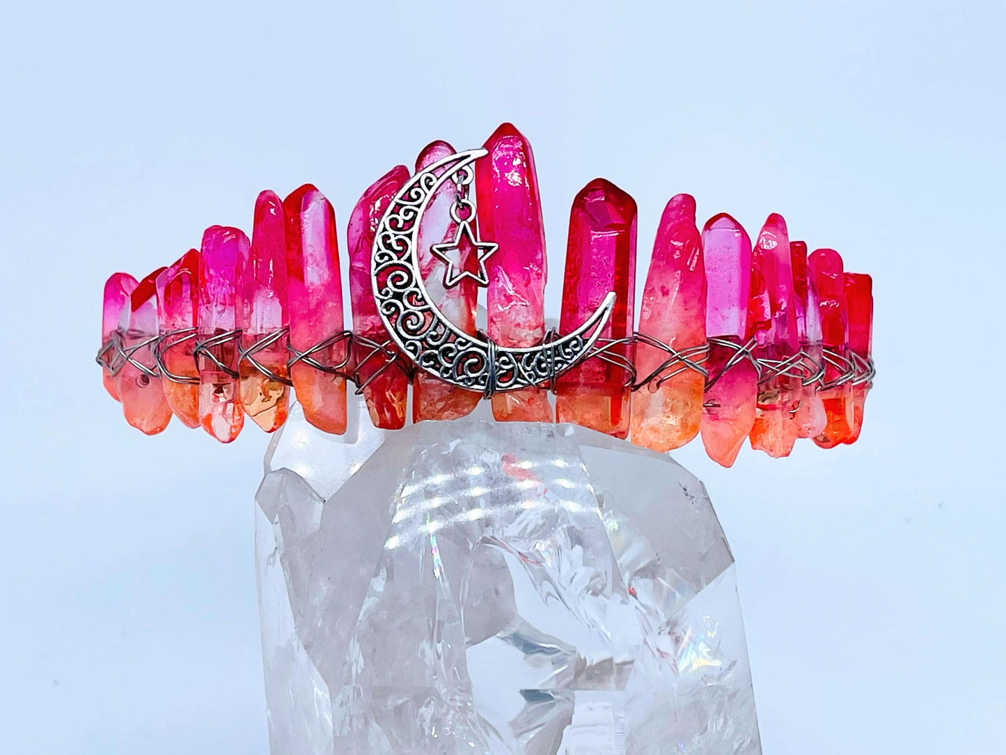 Orange quartz Crystal Crowns with silver Crescent Moon on white background 