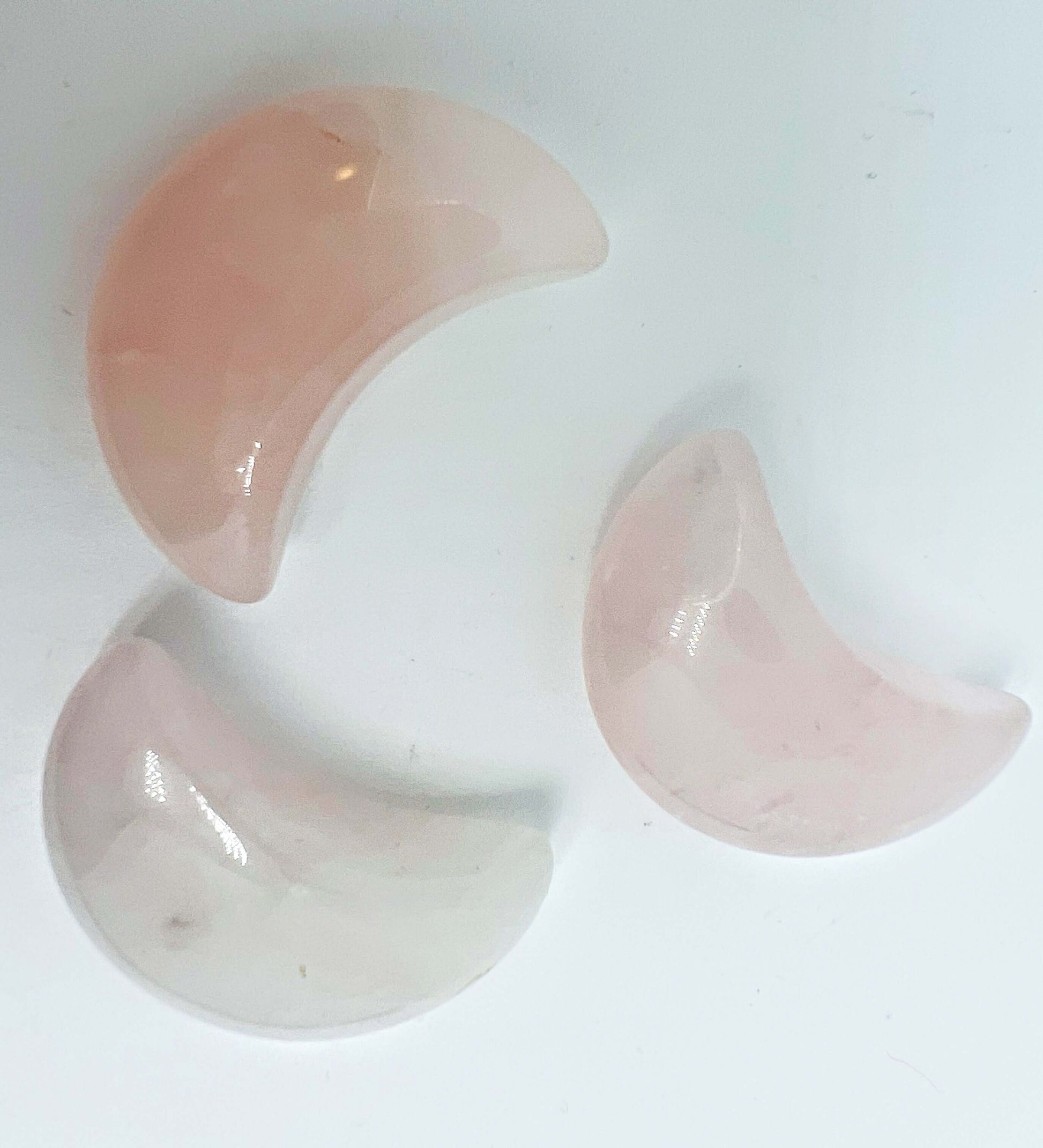 Three rose quartz Crystal moons