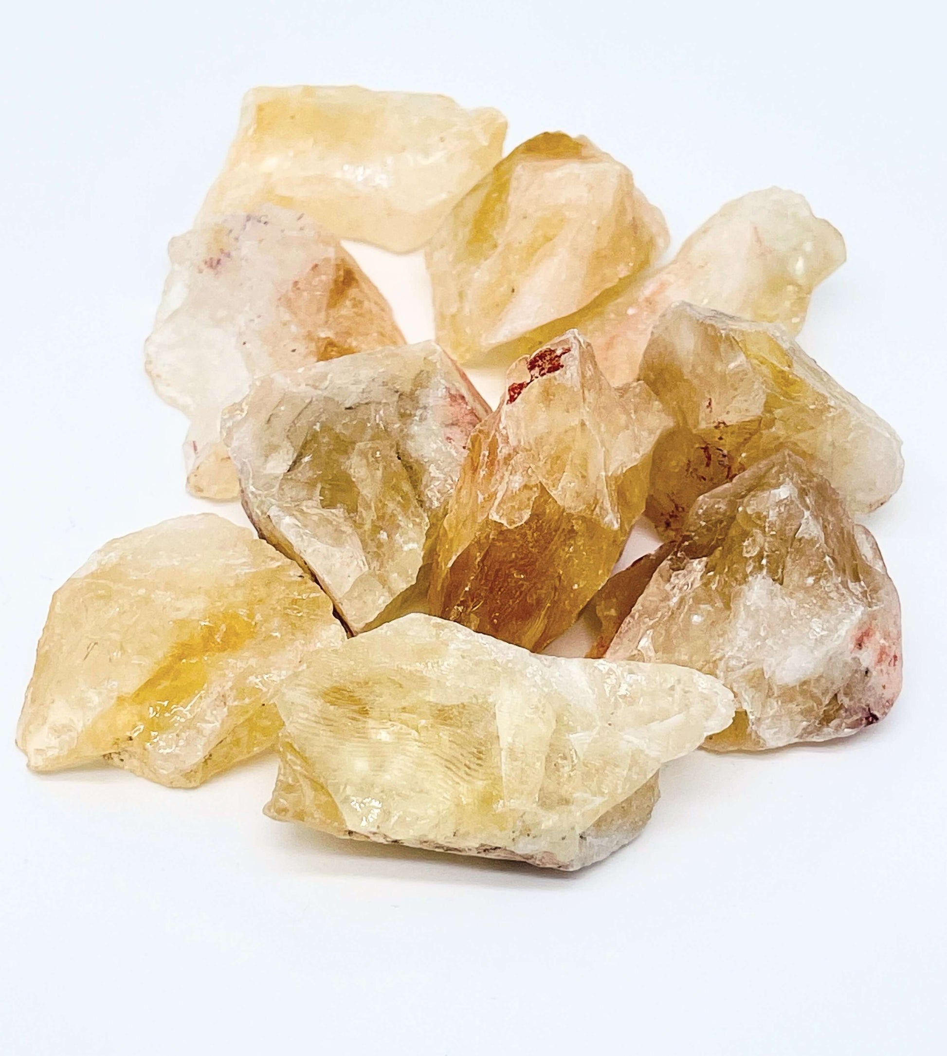 Several pieces of citrine on white background