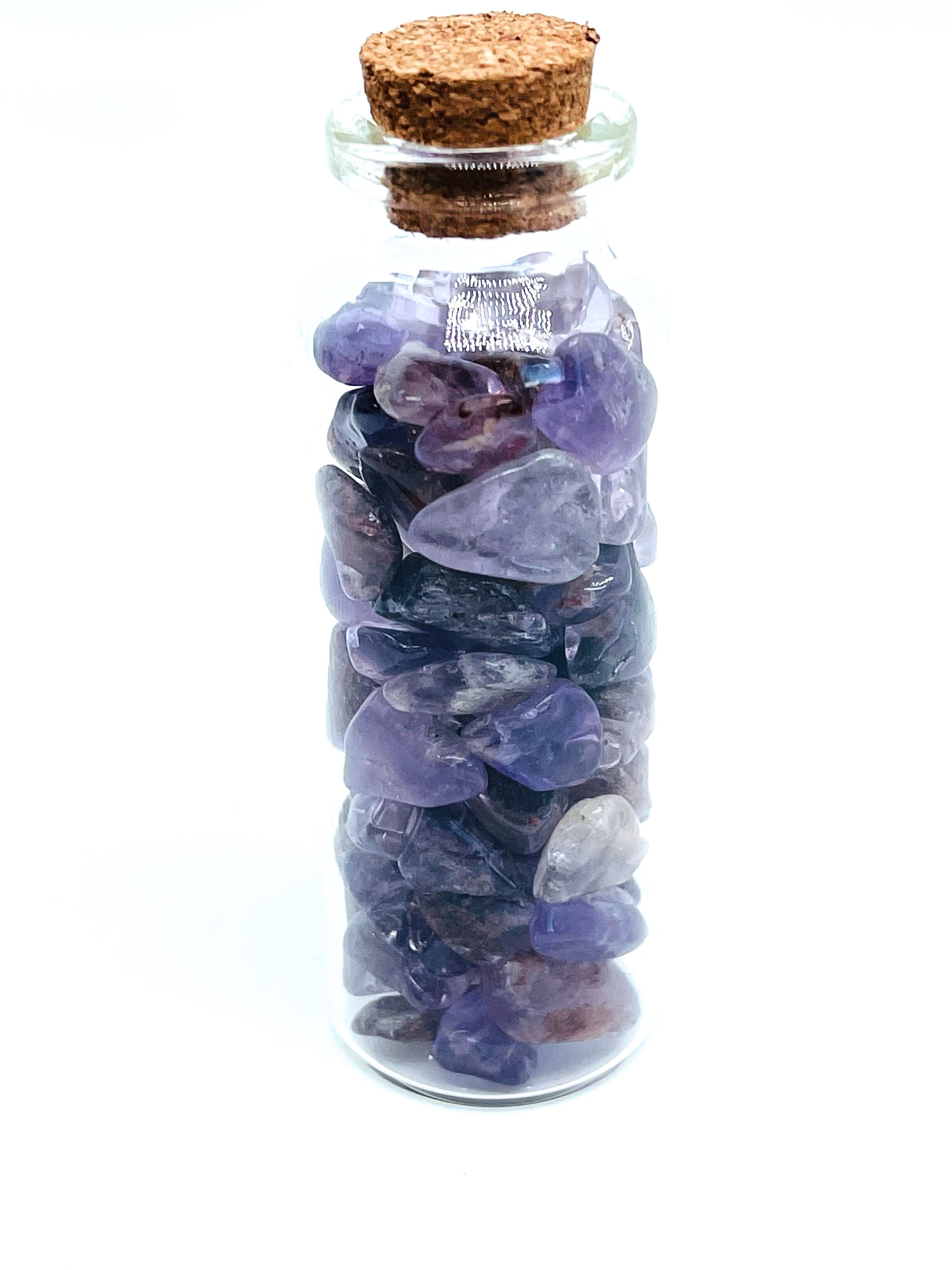 Amethyst crystal chip bottle on white background