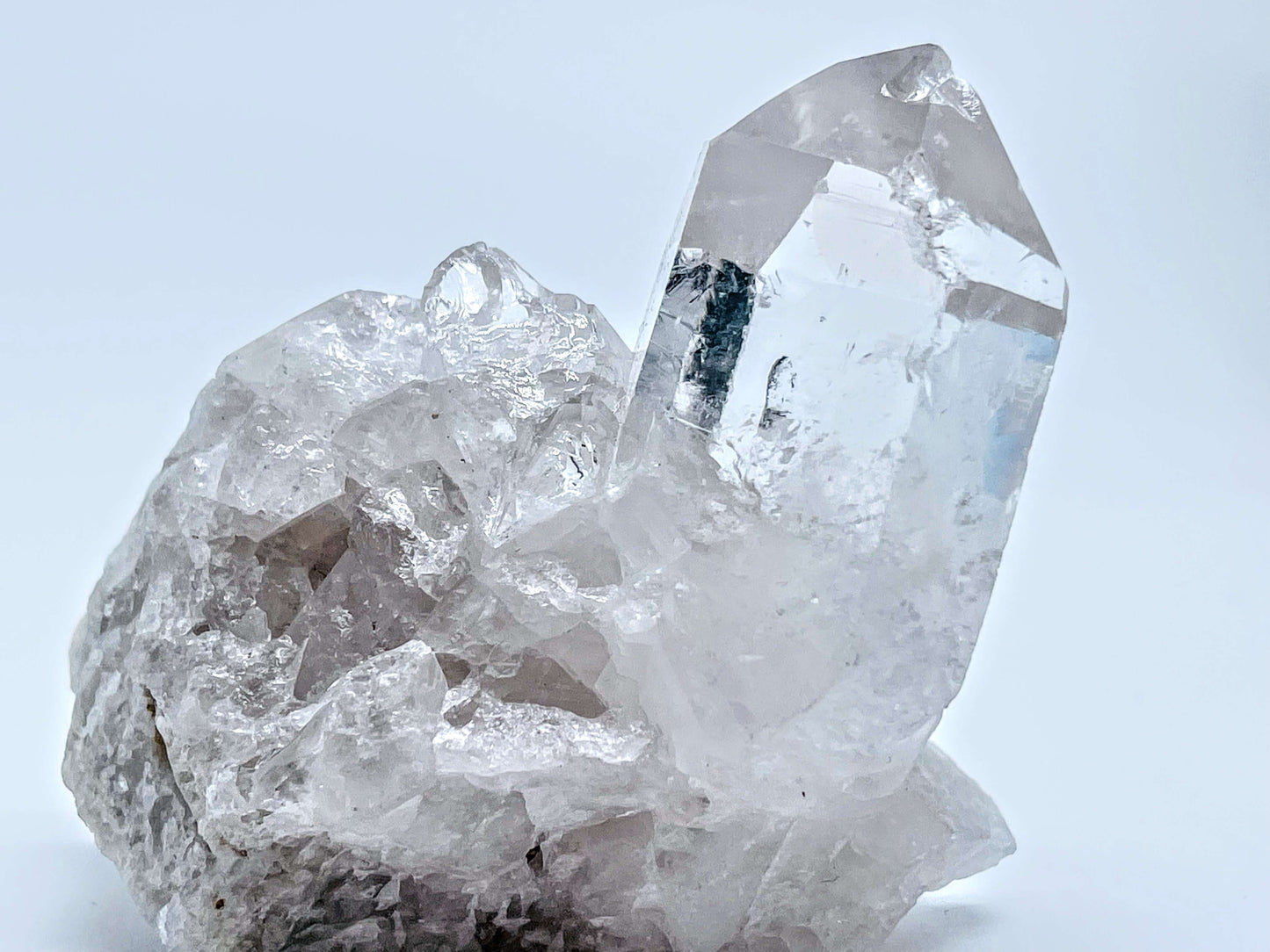 Clear quartz cluster on white background